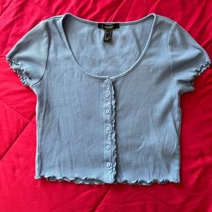 Woman’s light blue crop top
